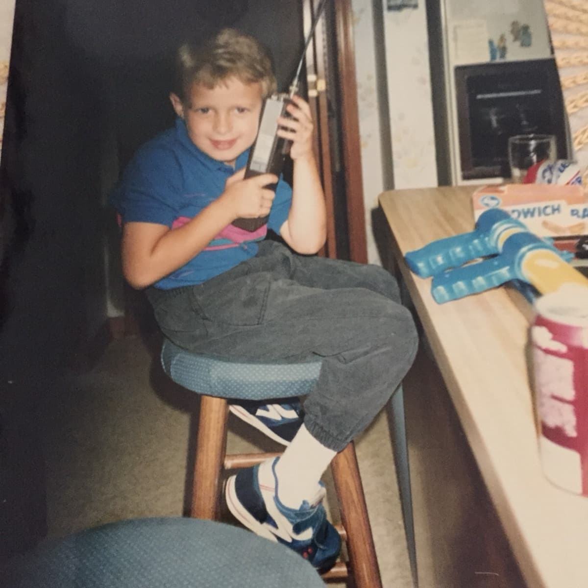 Nic Nash as a boy holding the Nash Mechanical two-way radio